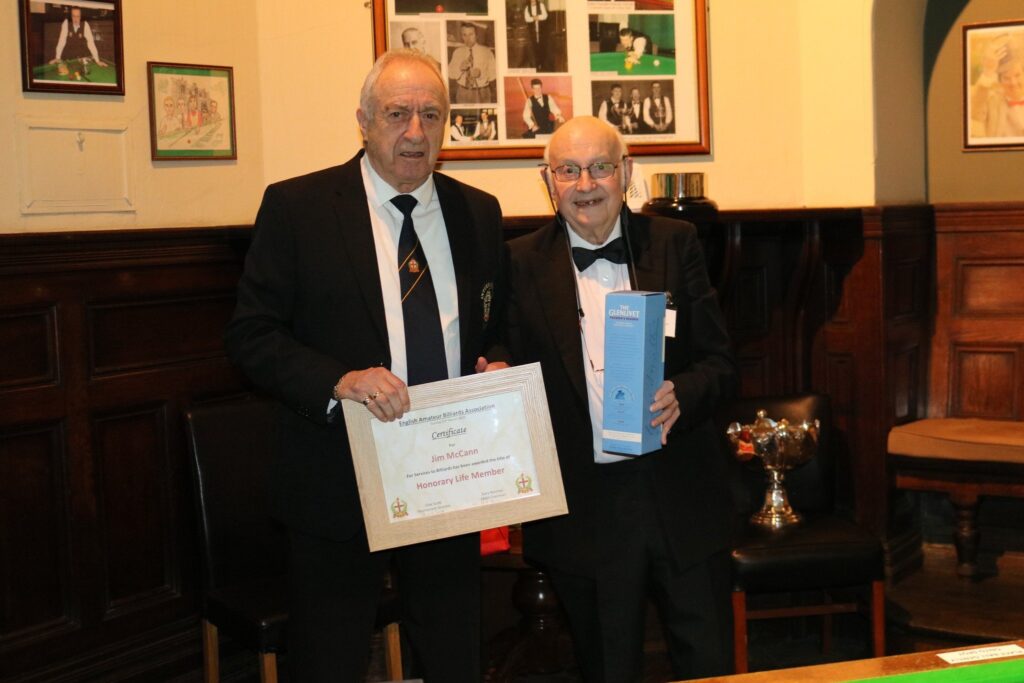 Jim McCann receiving his Honorary Life Membership of the EABA from Clive Scott